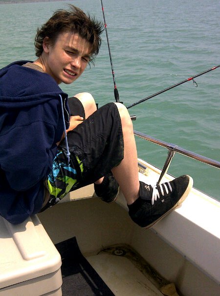 Devyn fishing for perch on Lake Erie with Grampa Chuck's Fishing Charters